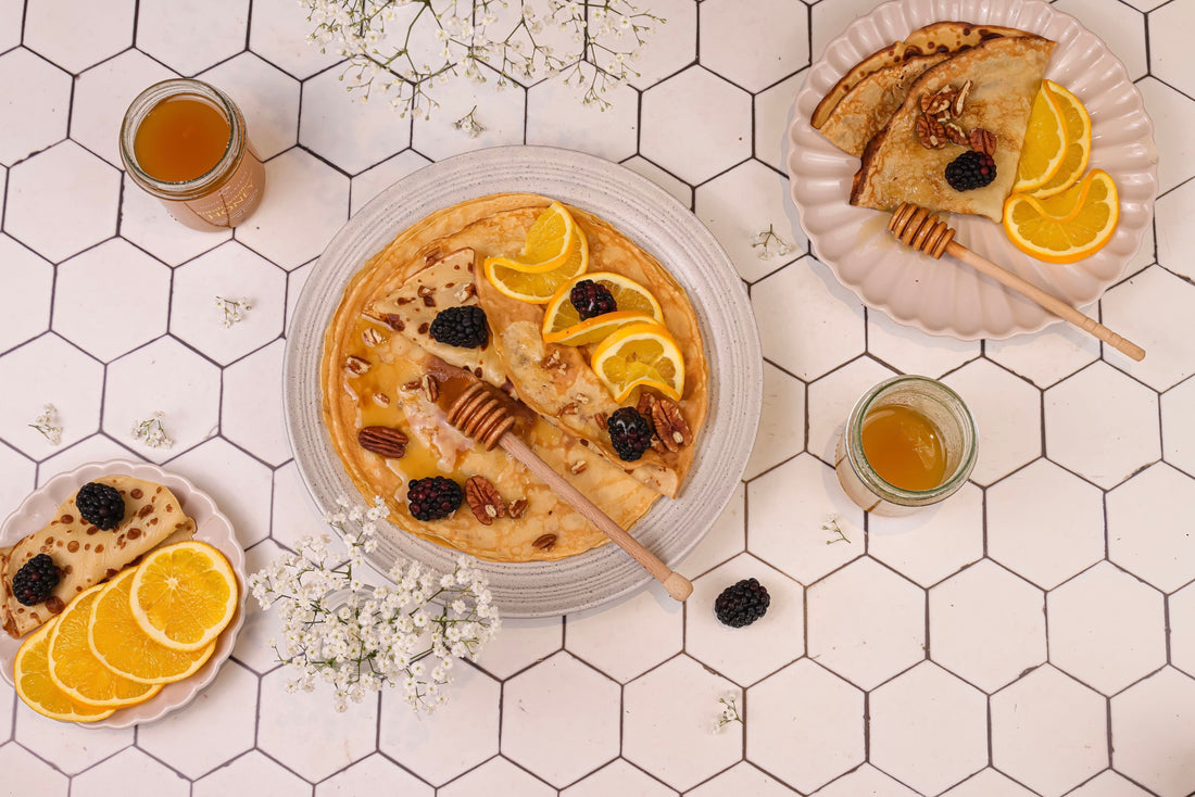 Honey crepes with orange and blackberries