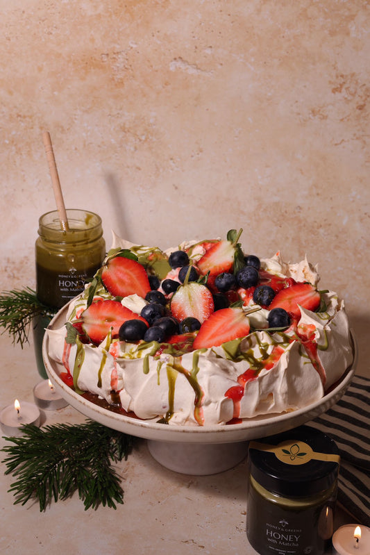 christmas pavlova cake with berries and organic matcha honey