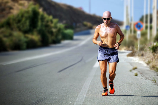 man running on tarred road